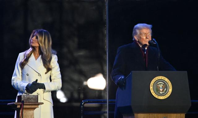 First Lady Melania Trump looks on as US President Donald Trump speaks at the National Christmas Tree Lighting at the Ellipse in Washington, DC, on December 4, 2025. (Photo by Alex WROBLEWSKI / AFP)