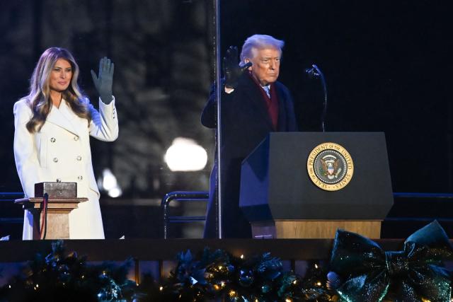US President Donald Trump and First Lady Melania Trump attend the National Christmas Tree Lighting at the Ellipse in Washington, DC, on December 4, 2025. (Photo by Alex WROBLEWSKI / AFP)