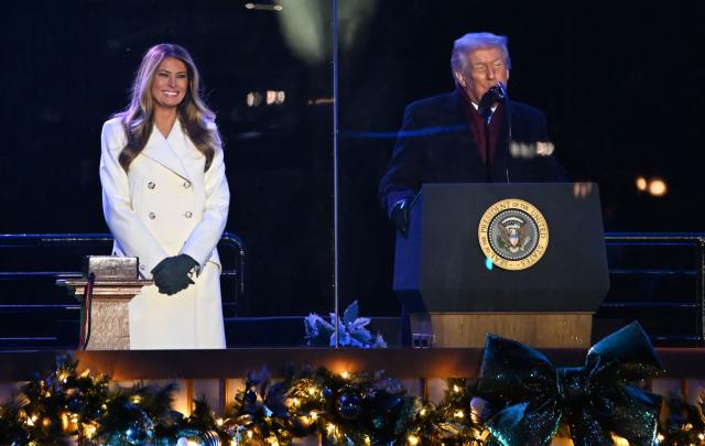 First Lady Melania Trump listes to US President Donald Trump speak at the National Christmas Tree Lighting at the Ellipse in Washington, DC, on December 4, 2025. (Photo by Alex WROBLEWSKI / AFP)
