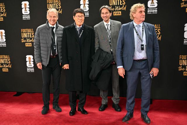 Former football players and managers Jurgen Klinsmann (L), of Germany, and Cha Bum-kun of Korea (2L) arrive with other guests for the pre-draw reception for the 2026 FIFA Football World Cup taking place in the US, Canada and Mexico, at the Kennedy Center, in Washington, DC, on December 4, 2025. (Photo by Roberto SCHMIDT / AFP)