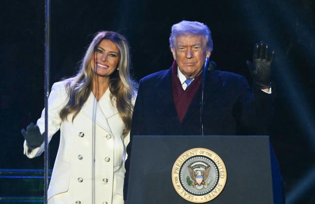 US President Donald Trump and First Lady Melania Trump attend the National Christmas Tree Lighting at the Ellipse in Washington, DC, on December 4, 2025. (Photo by ANDREW CABALLERO-REYNOLDS / AFP)