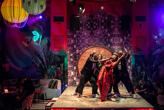 (FILES) A singer and dancers perform on stage at the Zaza restaurant and lounge in Lagos, on August 24, 2025. Scantily clad in a sequin leotard and silver heels, the dancer swayed to "Money" by Cardi B in a mega-sized cocktail glass.
Nigeria might be going through its worst economic crisis in a generation, but in Lagos, the party hasn't stopped.
Patrons at The Library, where fake banknotes rained down on the stage, were being treated to both dinner and a show as cabaret takes the mega-city by storm.
Clubs like The Library have been fully revamped to cash in on the trend, tapping into the best singers and dancers across the African cultural powerhouse, but also drawing talent from across the world. (Photo by OLYMPIA DE MAISMONT / AFP)