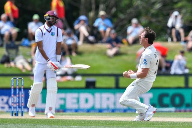 TOPSHOT - New Zealand's Matt Henry (R) celebrates the dismissal of West Indies' Roston Chase during day four of the first Test cricket match between New Zealand and West Indies at Hagley Oval in Christchurch on December 5, 2025. (Photo by Sanka Vidanagama / AFP)