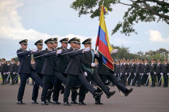 Air Force officers attend a promotion ceremony with Colombia's President Gustavo Petro at the Marco Fidel Suarez Air Force base in Cali, Colombia on December 4, 2025. (Photo by JOAQUIN SARMIENTO / AFP)
