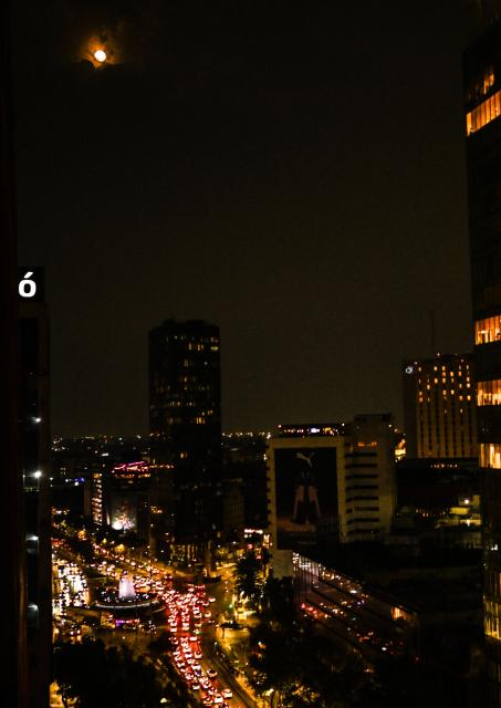 The last supermoon of 2025, the Cold Moon, rises above Mexico City on December 4, 2025. (Photo by Yuri CORTEZ / AFP)