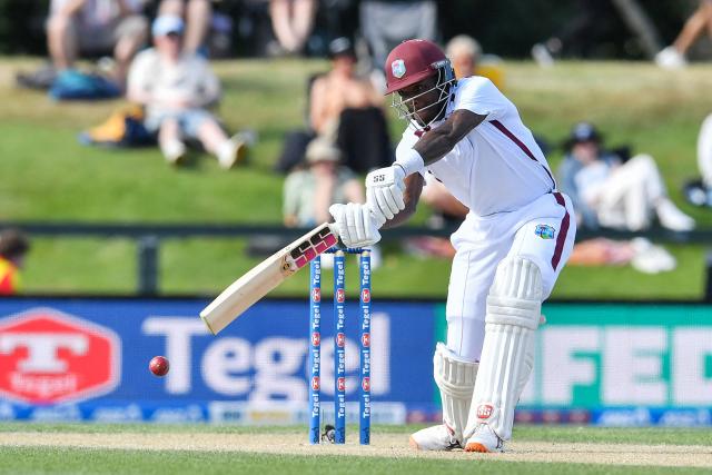 West Indies' Justin Greaves plays a shot during day four of the first Test cricket match between New Zealand and West Indies at Hagley Oval in Christchurch on December 5, 2025. (Photo by Sanka Vidanagama / AFP)