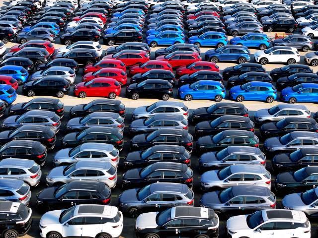Cars for export wait to be shipped at a port in Lianyungang, eastern China's Jiangsu province on December 4, 2025. (Photo by AFP) / China OUT
