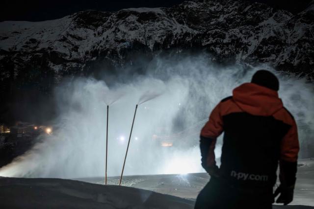 A snowmaker inspects the distribution of artificial snow through snow cannons at the Gourette ski resort near the Col d'Aubisque pass in the Pyrenees, south-western France on December 2, 2025. The family-oriented resort features one of the largest beginner areas in the Pyrenees and is a pioneer in the mountain range where skiing was first introduced in 1903 near Col d'Aubisque pass. (Photo by Philippe LOPEZ / AFP)
