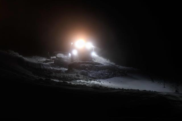 This photograph shows a snow groomer spreading artificial snow at the Gourette ski resort near the Col d'Aubisque pass in the Pyrenees, south-western France on December 3, 2025. The family-oriented resort features one of the largest beginner areas in the Pyrenees and is a pioneer in the mountain range where skiing was first introduced in 1903 near Col d'Aubisque pass. (Photo by Philippe LOPEZ / AFP)