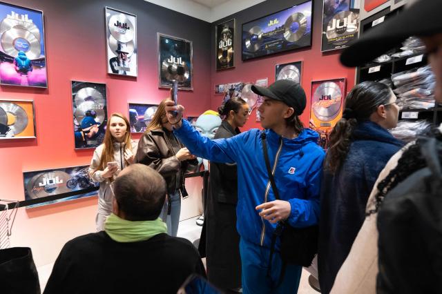 Customers visit the pop-up store of French rapper Jul on the day of its opening in Marseille, southern France on June 7, 2024 (Photo by Miguel MEDINA / AFP)