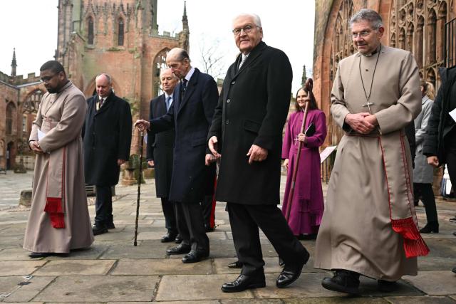 Britain's Prince Edward, Duke of Kent (centre left) and President of the Federal Republic of Germany Frank-Walter Steinmeier (centre right) tour the ruins of the old Cathedral in Coventry, central England on December 5, 2025, the final day of a three-day State visit to the UK by the German President. (Photo by Oli SCARFF / POOL / AFP)