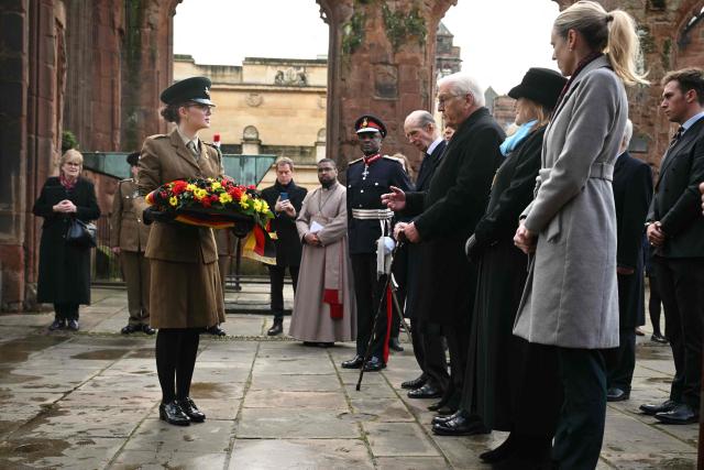 A cadet prepares to lay a floral wreath on behalf of The President in the ruins of the old Cathedral during a visit by President of the Federal Republic of Germany Frank-Walter Steinmeier to Coventry Cathedral in Coventry, central England on December 5, 2025, the final day of a three-day State visit to the UK by the German President. (Photo by Oli SCARFF / POOL / AFP)