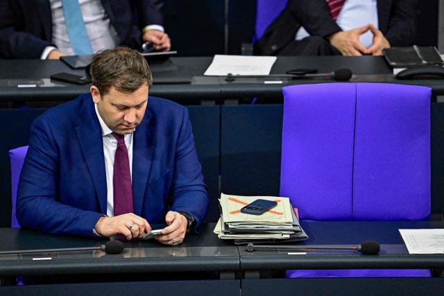 German Finance Minister and Vice Chancellor Lars Klingbeil attends a plenary session at the Bundestag, Germany's lower house of parliament in Berlin on December 5, 2025. German MP's are voting on a controversial pension package and a new military service plan. German MP's are voting on a controversial pension package and a new military service plan. (Photo by Tobias SCHWARZ / AFP)