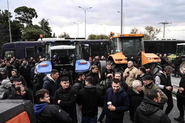 Farmers block the road leading to the airport of Thessaloniki, with tractors during a protest over the reduced and delayed payment of European Union subsidies, on December 5, 2025. (Photo by Sakis Mitrolidis / AFP)