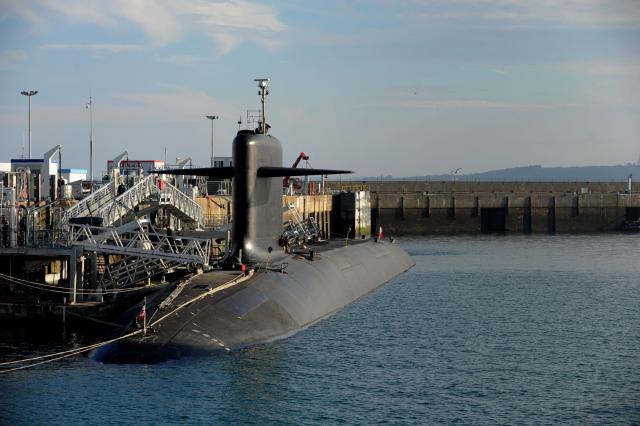 (FILES) A picture taken on December 5, 2016 shows a nuclear submarine at the naval base in Ile Longue, western of France. A judicial investigation will be opened on December 5, 2025 by the military prosecutor's office in Rennes after drones flew over the base housing French nuclear submarines in the Brest harbor (Finistère) on December 4 evening, the Atlantic Maritime Prefecture told AFP. (Photo by FRED TANNEAU / AFP)