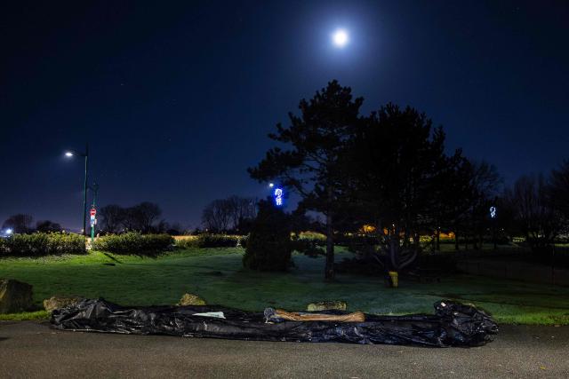This photograph shows a damaged smuggling boat lying on the ground in Gravelines, northern France, on December 5, 2025. (Photo by Sameer Al-DOUMY / AFP)