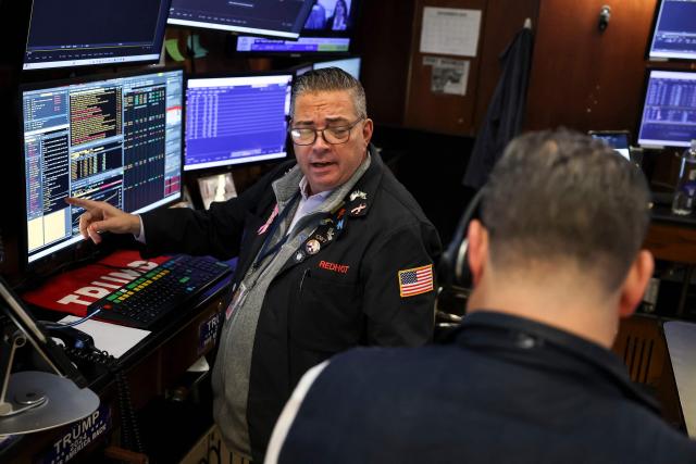 A trader works on the floor of the New York Stock Exchange (NYSE) after the opening bell in New York on December 5, 2025.  (Photo by ANGELA WEISS / AFP)