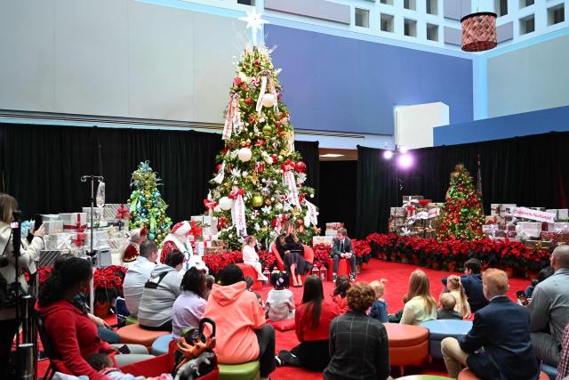 US First Lady Melania Trump reads the book “How Does Santa Go Down the Chimney” during a Children's National Hospital holiday event in Washington, DC on December 5, 2025. (Photo by Alex WROBLEWSKI / AFP)