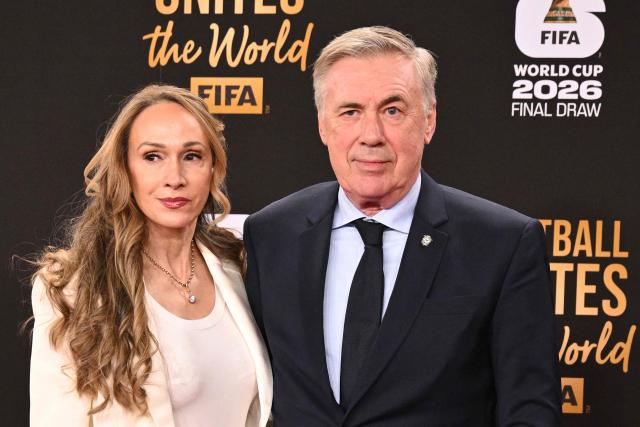 Brazil's Italian head coach Carlo Ancelotti and his wife Mariann Barrena McClay pose on the red carpet upon arrival to attend the draw for the 2026 FIFA Football World Cup taking place in the US, Canada and Mexico, at the Kennedy Center, in Washington, DC, on December 5, 2025. (Photo by Roberto SCHMIDT / AFP)