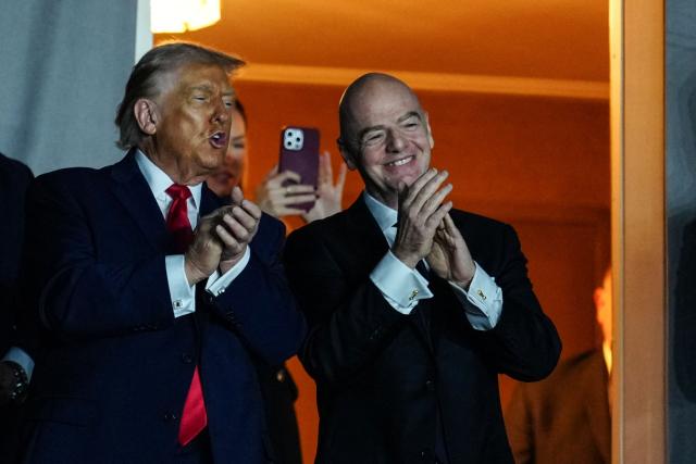 Italian Fifa President Gianni Infantino and US President Donald Trump arrive to the draw for the 2026 FIFA Football World Cup taking place in the US, Canada and Mexico, at the Kennedy Center, in Washington, DC, on December 5, 2025. (Photo by Jia Haocheng / POOL / AFP)