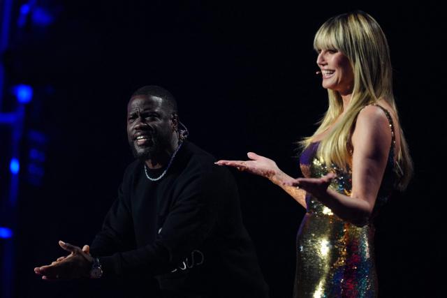 US comedian and actor Kevin Hart and German US Supermodel Producer TV host Heidi Klum deliver a speech during the draw for the 2026 FIFA Football World Cup taking place in the US, Canada and Mexico, at the Kennedy Center, in Washington, DC, on December 5, 2025. (Photo by Jia Haocheng / POOL / AFP)