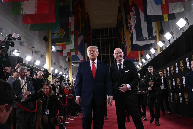 (L-R) US President Donald Trump and FIFA President Gianni Infantino pose on the red carpet upon arrival to attend the draw for the 2026 FIFA Football World Cup taking place in the US, Canada and Mexico, at the Kennedy Center, in Washington, DC, on December 5, 2025. (Photo by Brendan SMIALOWSKI / AFP)