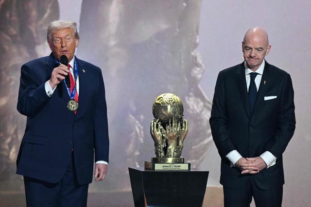 (L-R) US President Donald Trump speaks next to FIFA President Gianni Infantino after being awarded the FIFA Peace Prize during the draw for the 2026 FIFA Football World Cup taking place in the US, Canada and Mexico, at the Kennedy Center, in Washington, DC, on December 5, 2025. (Photo by Jim WATSON / AFP)