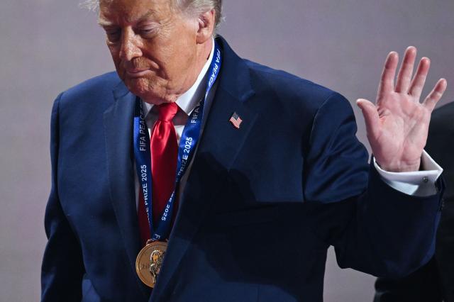 US President Donald Trump leaves the stage after receiving the FIFA Peace Prize during the draw for the 2026 FIFA Football World Cup taking place in the US, Canada and Mexico, at the Kennedy Center, in Washington, DC, on December 5, 2025. (Photo by SAUL LOEB / AFP)