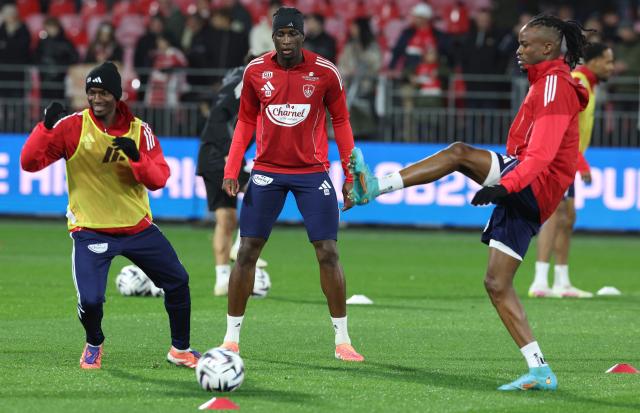 (From L) Brest's Malian midfielder #23 Kamory Doumbia and Brest's French defender #44 Soumaila Coulibaly warm up ahead of the French L1 football match between Stade Brestois 29 (Brest) and AS Monaco at the Francis-Le-Ble stadium in Brest, western France, on December 5, 2025. (Photo by Fred TANNEAU / AFP)