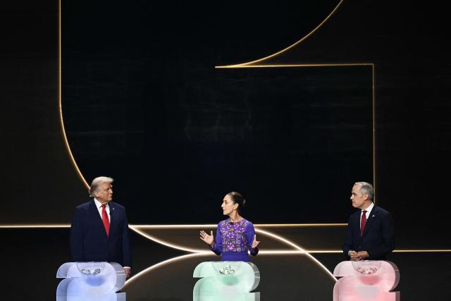 (L-R) US President Donald Trump, Mexico's President Claudia Sheinbaum, and Canada's Prime Minister Mark Carney stand on stage during the draw for the 2026 FIFA Football World Cup taking place in the US, Canada and Mexico, at the Kennedy Center, in Washington, DC, on December 5, 2025. (Photo by Brendan SMIALOWSKI / AFP)