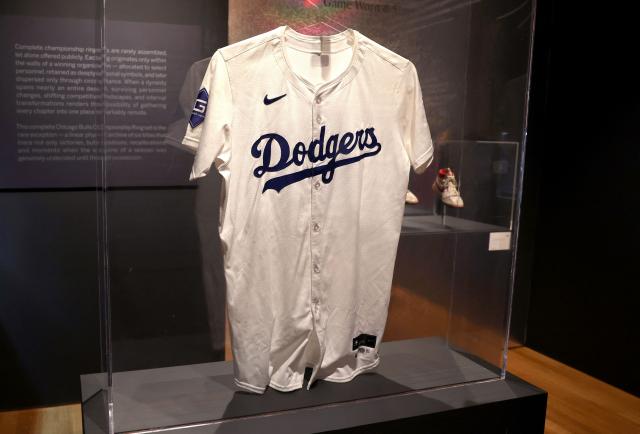 Shohei Ohtani Game Worn Dodgers Jersey (Number 42 ‘Jackie Robinson Day’, 50/50 Season, NL MVP Season, Signed In Kanji, Stolen Base No. 3) is seen on display during a press preview December 5, 2025 for the Inaugural Luxury Week Sales at Sotheby’s New Global Headquarters at the Breuer Building Historic and Cultural Icons in New York. (Photo by TIMOTHY A. CLARY / AFP)