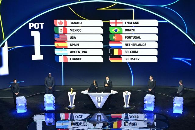 Pot 1 nations are displayed on a scren during the draw for the 2026 FIFA Football World Cup taking place in the US, Canada and Mexico, at the Kennedy Center, in Washington, DC, on December 5, 2025. (Photo by Roberto SCHMIDT / AFP)