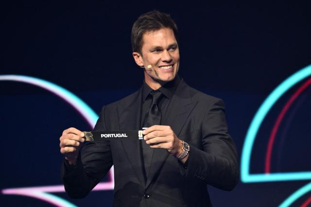 US Draw assistant Tom Brady shows the card reading Portugal during the draw for the 2026 FIFA Football World Cup taking place in the US, Canada and Mexico, at the Kennedy Center, in Washington, DC, on December 5, 2025. (Photo by Mandel NGAN / POOL / AFP)