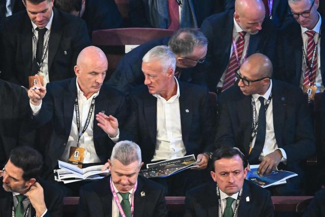 France's assistant coach Guy Stephan, France's coach Didier Deschamps and the President of the French Football Federation Philippe Diallo are seen during the draw for the 2026 FIFA Football World Cup taking place in the US, Canada and Mexico, at the Kennedy Center, in Washington, DC, on December 5, 2025. (Photo by Pedro UGARTE / AFP)