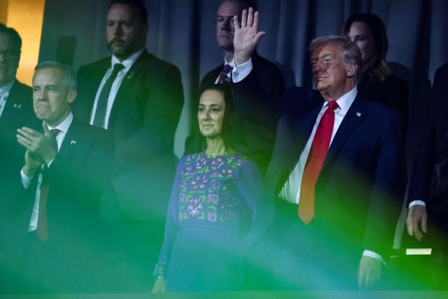 (From L) Canada's Prime Minister Mark Carney, Mexico's President Claudia Sheinbaum and US President Donald Trump react after the results of the draw for the 2026 FIFA Football World Cup taking place in the US, Canada and Mexico, at the Kennedy Center, in Washington, DC, on December 5, 2025. (Photo by Dan Mullan / POOL / AFP)