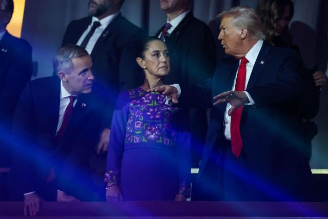 (From L) Canada's Prime Minister Mark Carney, Mexico's President Claudia Sheinbaum and US President Donald Trump chat after the draw for the 2026 FIFA Football World Cup taking place in the US, Canada and Mexico, at the Kennedy Center, in Washington, DC, on December 5, 2025. (Photo by Dan Mullan / AFP)