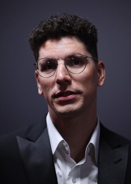Portuguese cyclist Joao Almeida poses for a photocall ahead of the Velo d'Or 2025 award ceremony at the Pavillon Gabriel in Paris on December 5, 2025. (Photo by Anne-Christine POUJOULAT / AFP)