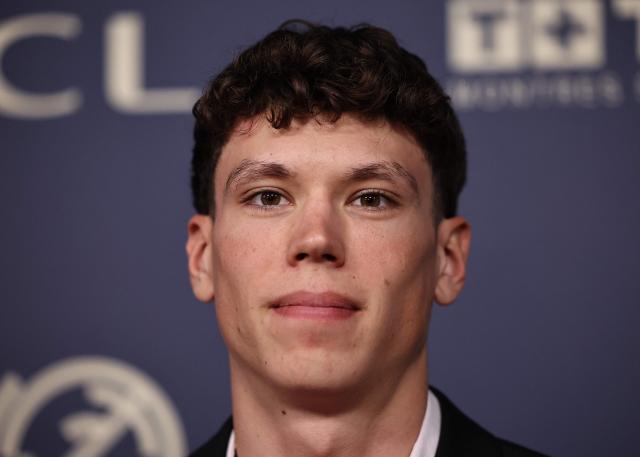 French cyclist Paul Magnier poses for a photocall ahead of the Velo d'Or 2025 award ceremony at the Pavillon Gabriel in Paris on December 5, 2025. (Photo by Anne-Christine POUJOULAT / AFP)