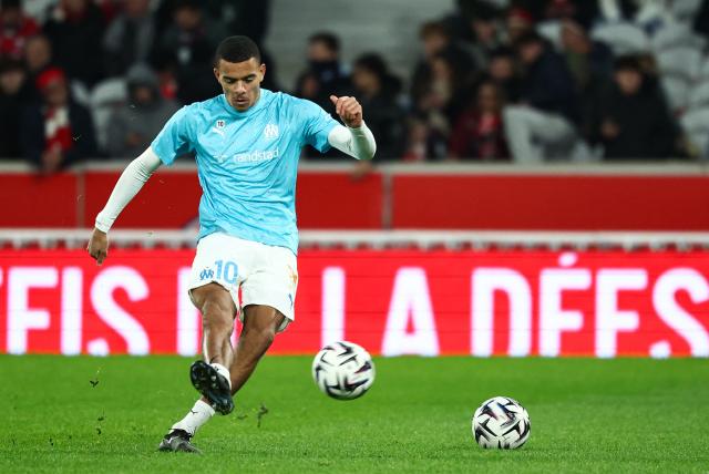 Marseille's English forward #10 Mason Greenwood kicks the ball during the warm-up ahead of the French L1 football match between Lille LOSC and Olympique de Marseille (OM) at the Pierre-Mauroy stadium in Villeneuve-d'Ascq, northern France, on December 5, 2025. (Photo by Sameer AL-DOUMY / AFP)