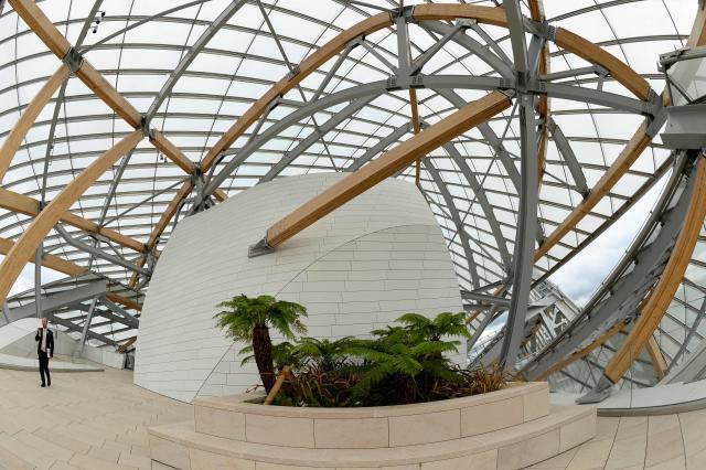 (FILES) Interior view of the Louis Vuitton Foundation designed by Canadian-American architect Frank Gehry in the Bois de Boulogne in Paris on October 17, 2014. The building which takes the form of a sailboat amongst the trees of the Bois de Boulogne, consists of twelve huge sails glass, and is part of the long tradition of architectural glass such as the Grand Palace. The  AFP PHOTO / BERTRAND GUAY. Famed US-Canadian architect Frank Gehry, whose prolific portfolio included the Guggenheim Bilbao and Walt Disney Concert Hall in Los Angeles, died December 5, 2025, aged 96 at his home in California, his office told AFP. (Photo by BERTRAND GUAY / AFP)