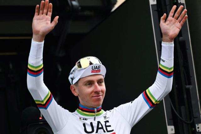 (FILES) UAE Team Emirates team's Slovenian rider Tadej Pogacar celebrates his victory on the podium after the 118th edition of the Giro di Lombardia (Tour of Lombardy), a 252km cycling race from Bergamo to Como on October 12, 2024. Winners of the Tour de France 2025, Slovenian Tadej Pogacar and Frenchwoman Pauline Ferrand-Prevot were awarded the Velo d'or trophy, designating the best male and female cyclists of the year 2025, on December 5, 2025 during a ceremony in Paris. (Photo by Marco BERTORELLO / AFP)