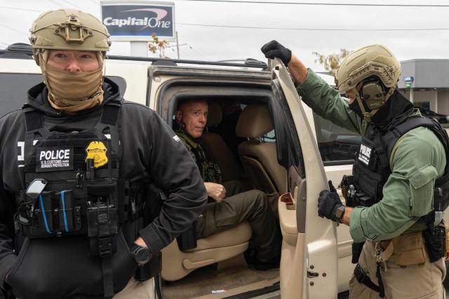 US Customs and Border Patrol Commander Gregory Bovino (C) and fellow agents stop at a gas station during an immigration raid in Kenner, Louisiana, on December 5, 2025. The US Department of Homeland Security announced on December 3 it has launched a federal immigration enforcement operation, named "Operation Catahoula Crunch," in the New Orleans, Louisiana, area. (Photo by Adam GRAY / AFP)