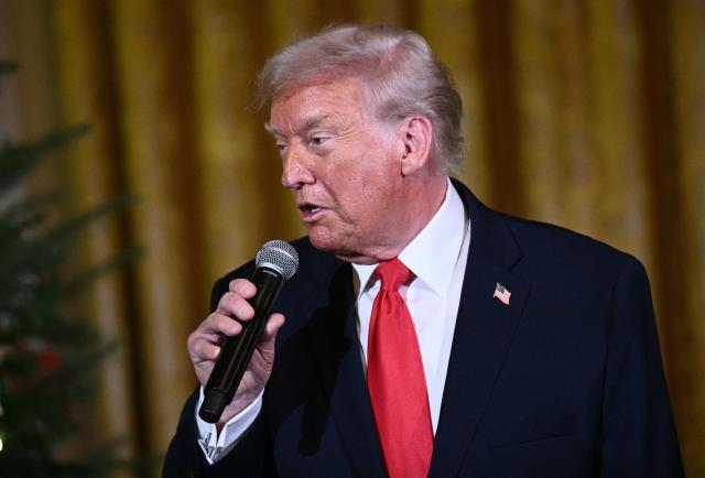 US President Donald Trump delivers remarks before attending a concert by Andrea Bocelli in the East Room of the WHite House in Washington, DC on December 5, 2025. (Photo by Brendan SMIALOWSKI / AFP)