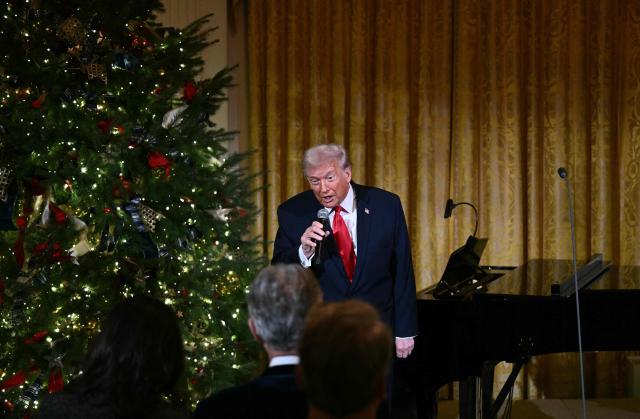 US President Donald Trump delivers remarks before attending a concert by Andrea Bocelli in the East Room of the WHite House in Washington, DC on December 5, 2025. (Photo by Brendan SMIALOWSKI / AFP)