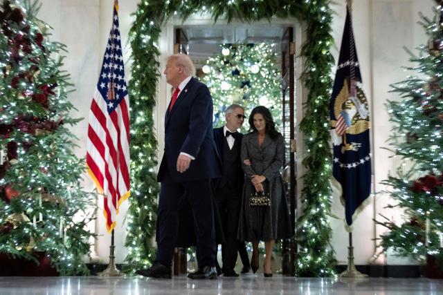 Italian tenor Andrea Bocelli and his wife Veronica Berti follow US President Donald Trump to the East Room of the White House in Washington, DC on December 5, 2025. (Photo by Brendan Smialowski / AFP)