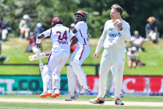 West Indies' Justin Greaves (C) and Kemar Roach collide as they run between the wickets during day five of the first Test cricket match between New Zealand and West Indies at Hagley Oval in Christchurch on December 6, 2025. (Photo by Sanka Vidanagama / AFP)