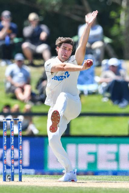 New Zealand's Zak Foulkes bowls during day five of the first Test cricket match between New Zealand and West Indies at Hagley Oval in Christchurch on December 6, 2025. (Photo by Sanka Vidanagama / AFP)