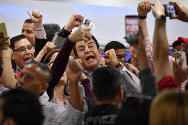 Salvador Nasralla, presidential candidate for the opposition Liberal Party, greet supporters in Tegucigalpa on December 5, 2025. Hondurans waited on December 5, 2025, for results from a tight presidential race held five days earlier, with a technical tie persisting between Asfura, a right-wing candidate favored by US President Donald Trump, and the candidate for the Liberal Party Nasralla. (Photo by Orlando SIERRA / AFP)