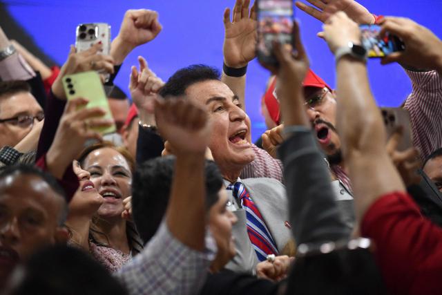 Salvador Nasralla, presidential candidate for the opposition Liberal Party, poses for pictures with supporters in Tegucigalpa on December 5, 2025. Hondurans waited on December 5, 2025, for results from a tight presidential race held five days earlier, with a technical tie persisting between Asfura, a right-wing candidate favored by US President Donald Trump, and the candidate for the Liberal Party Nasralla. (Photo by Orlando SIERRA / AFP)