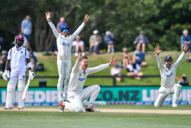 New Zealand's Michael Bracewell (C) and his teammates unsuccessfully appeal for a leg before wicket decision against West Indies' Kemar Roach during day five of the first Test cricket match between New Zealand and West Indies at Hagley Oval in Christchurch on December 6, 2025. (Photo by Sanka Vidanagama / AFP)